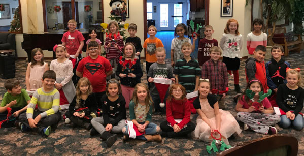 3rd grade class group picture at area senior facility.